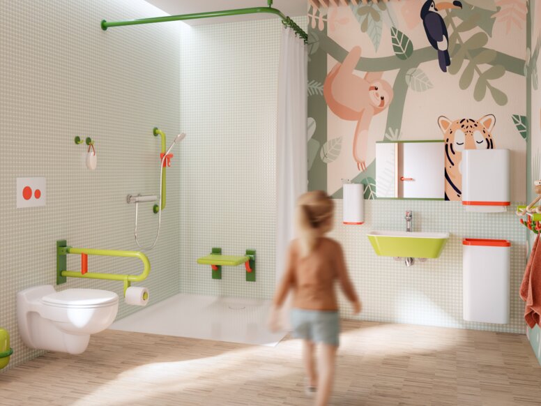 Colourful and child-friendly bathroom equipped with sanitary accessories in shades of green, white and coral